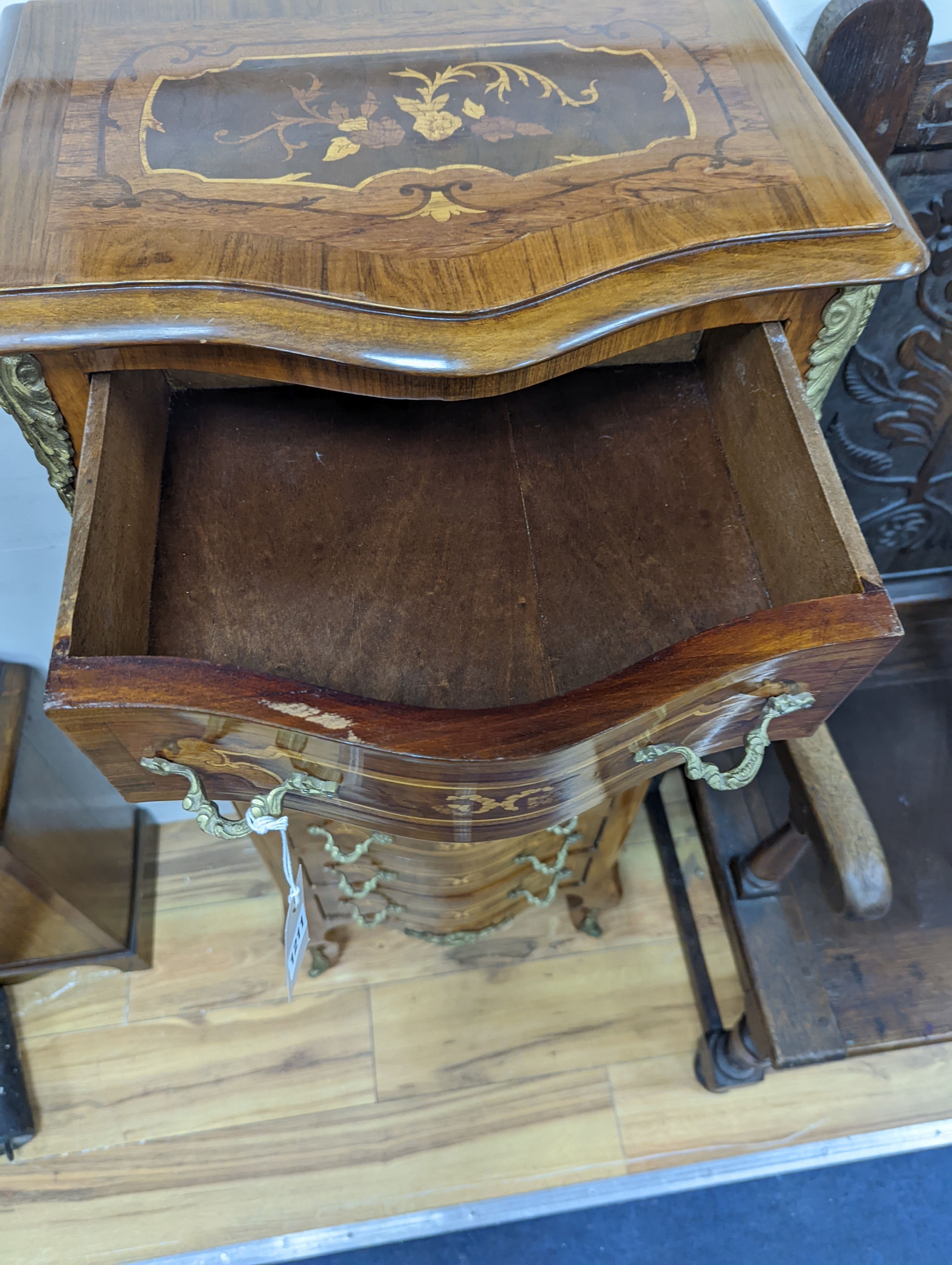 A Louis XV style marquetry inlaid serpentine fronted semanier, fitted seven small drawers, width 47cm, height 122cm